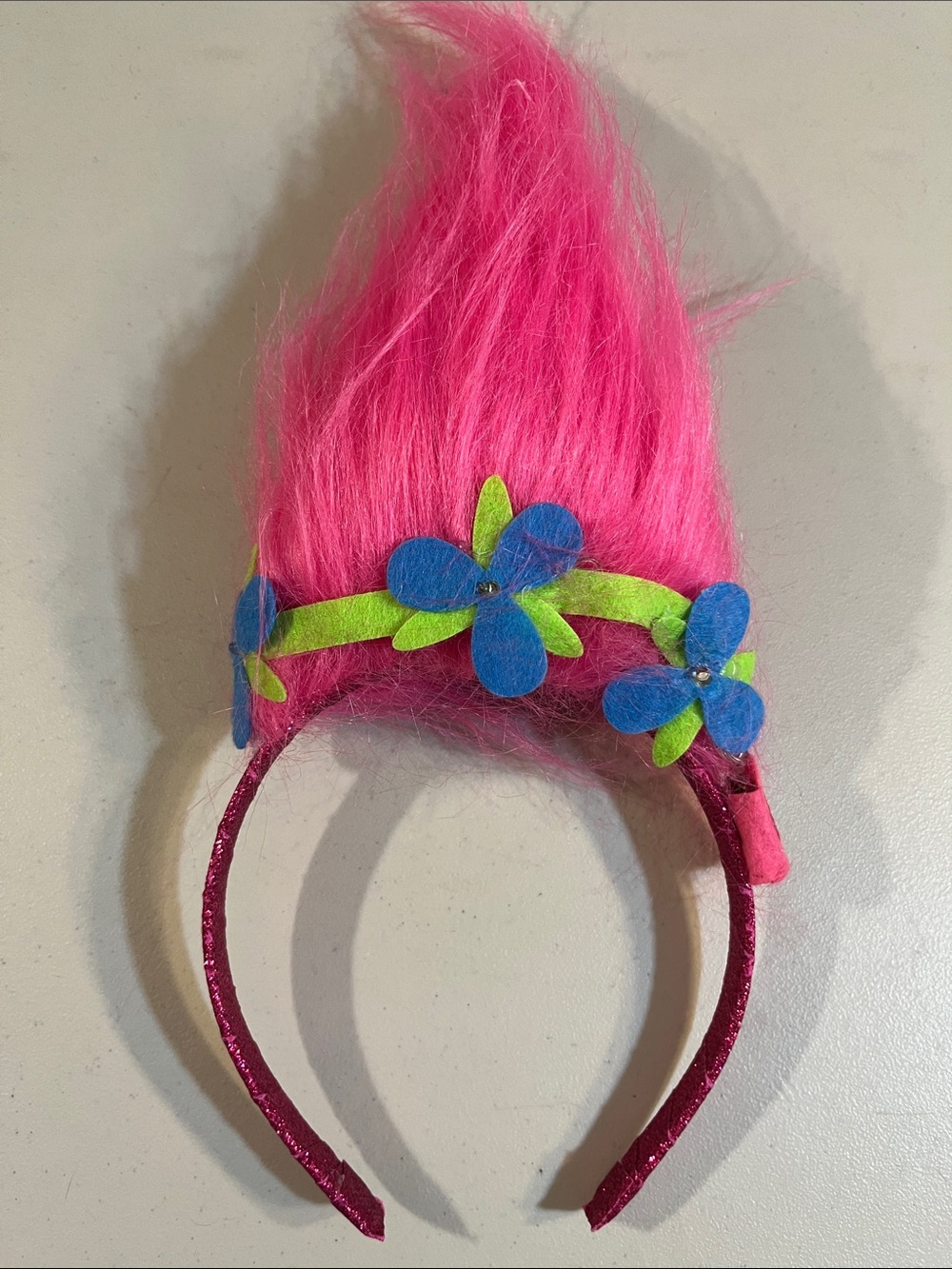 Trolls Bright Pink Faux Fur Headband with Blue and Lime Flowers